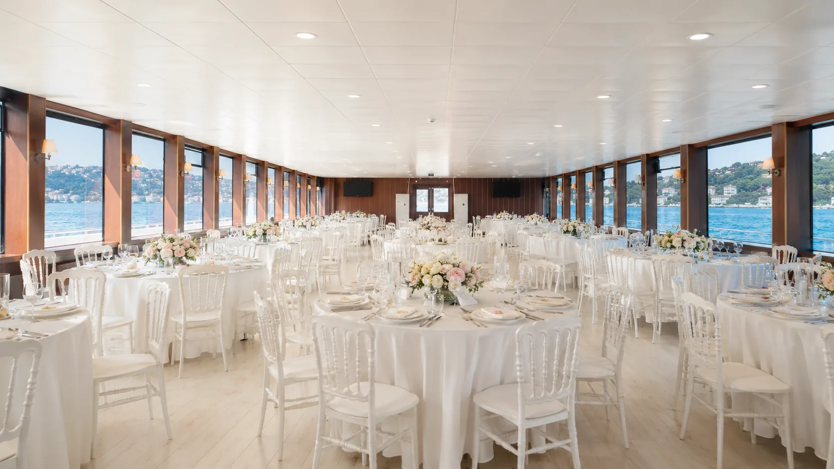 The climate-controlled salon set for a banquet with panoramic windows